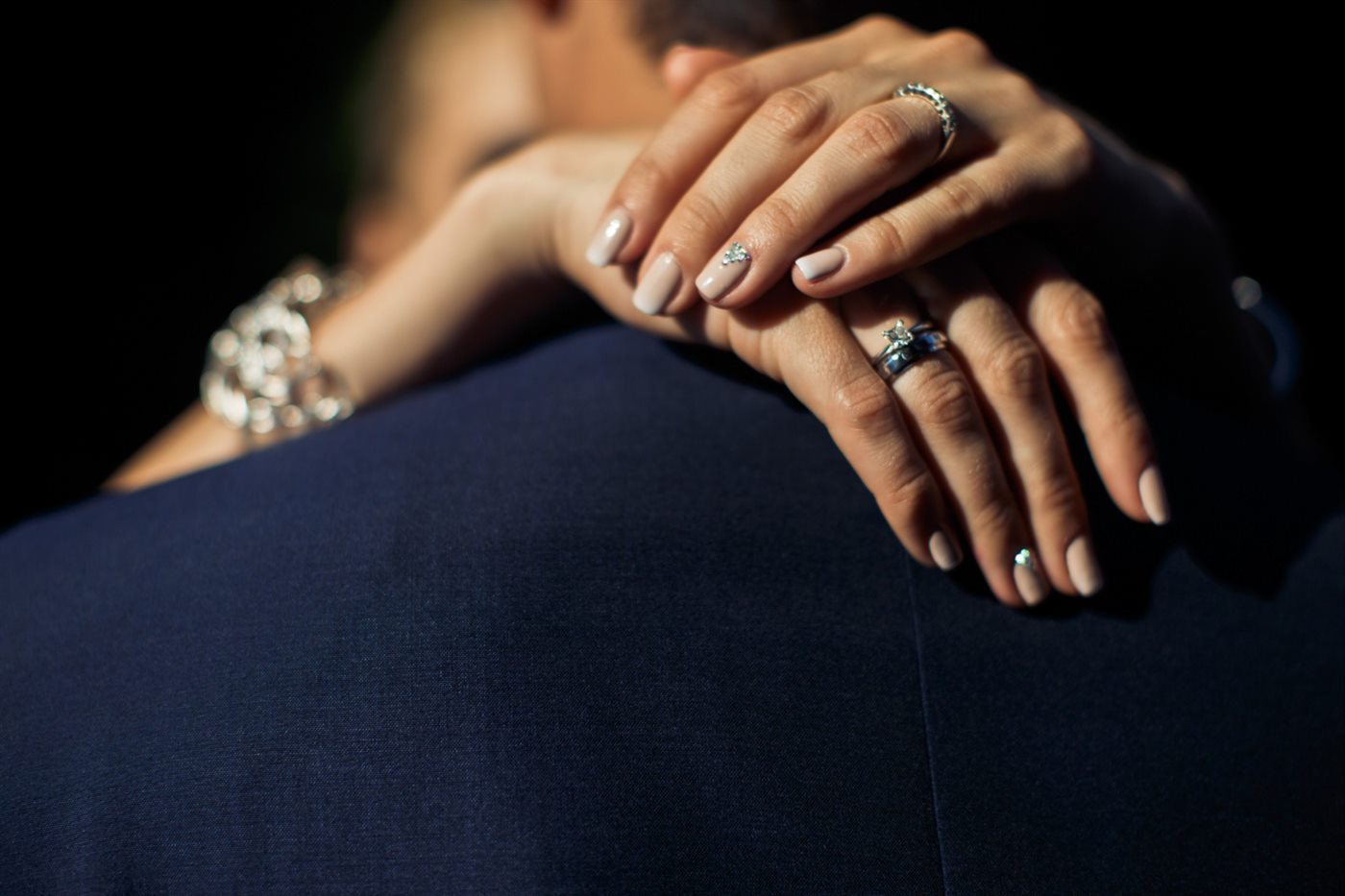 Diamond rings worn on a hand during a meaningful moment